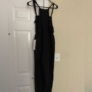 NEW WITH TAG!! VANILLA STAR BLACK ROMPER! SIZE S.